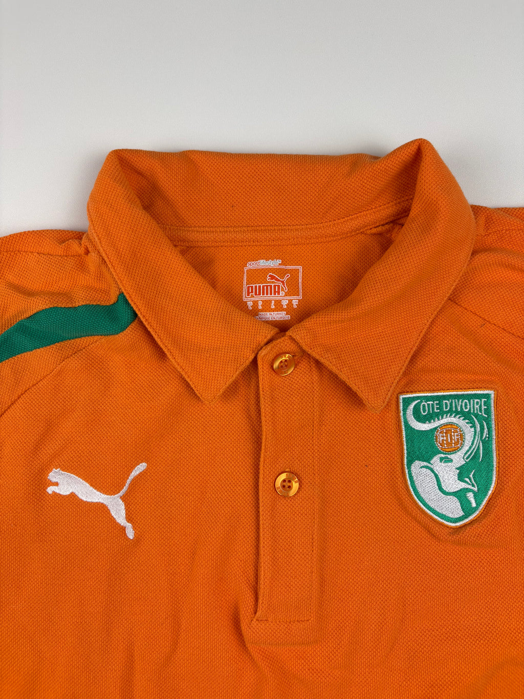 (S) Puma Poloshirt "Elfenbeinküste" in Orange