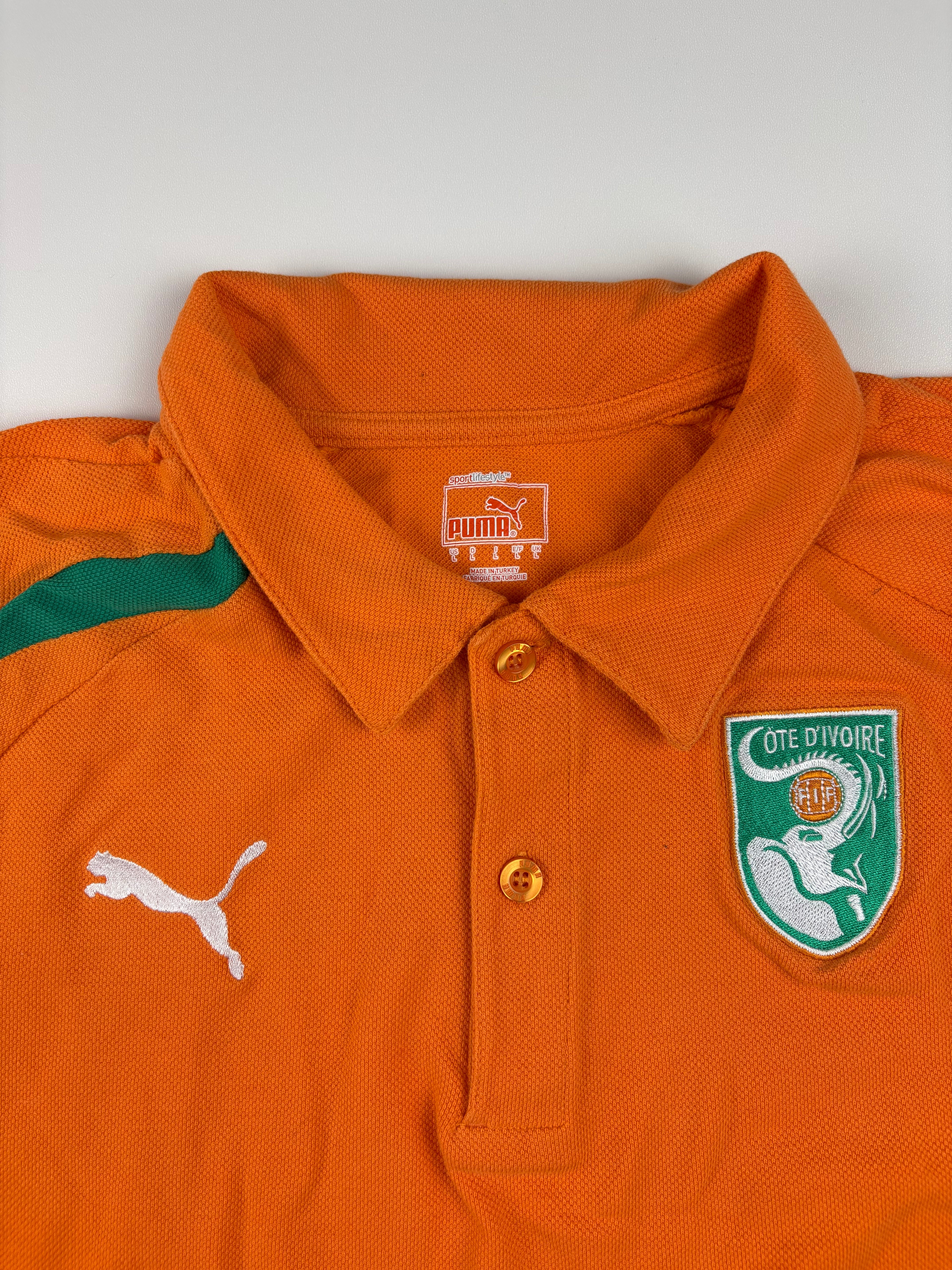 (S) Puma Poloshirt "Elfenbeinküste" in Orange